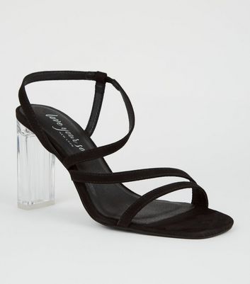 clear and black strappy heels