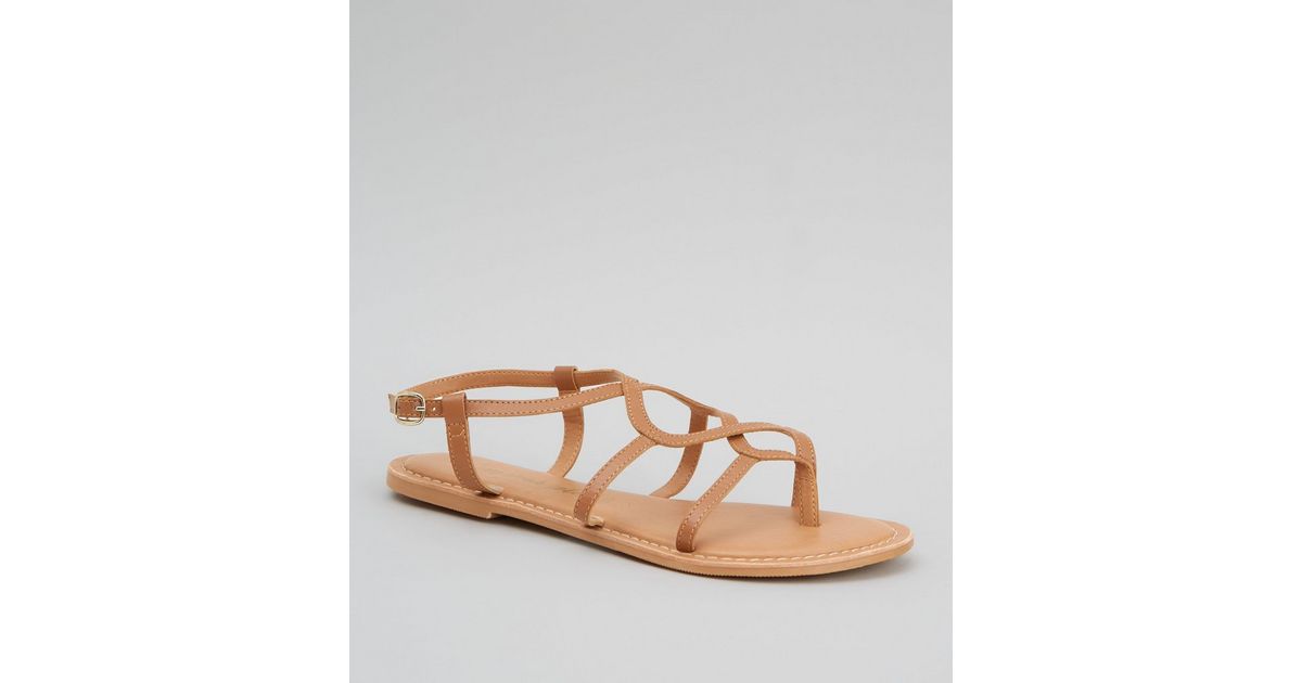 tan t strap sandals