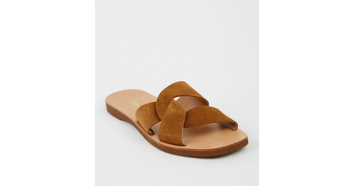 tan cross strap sliders