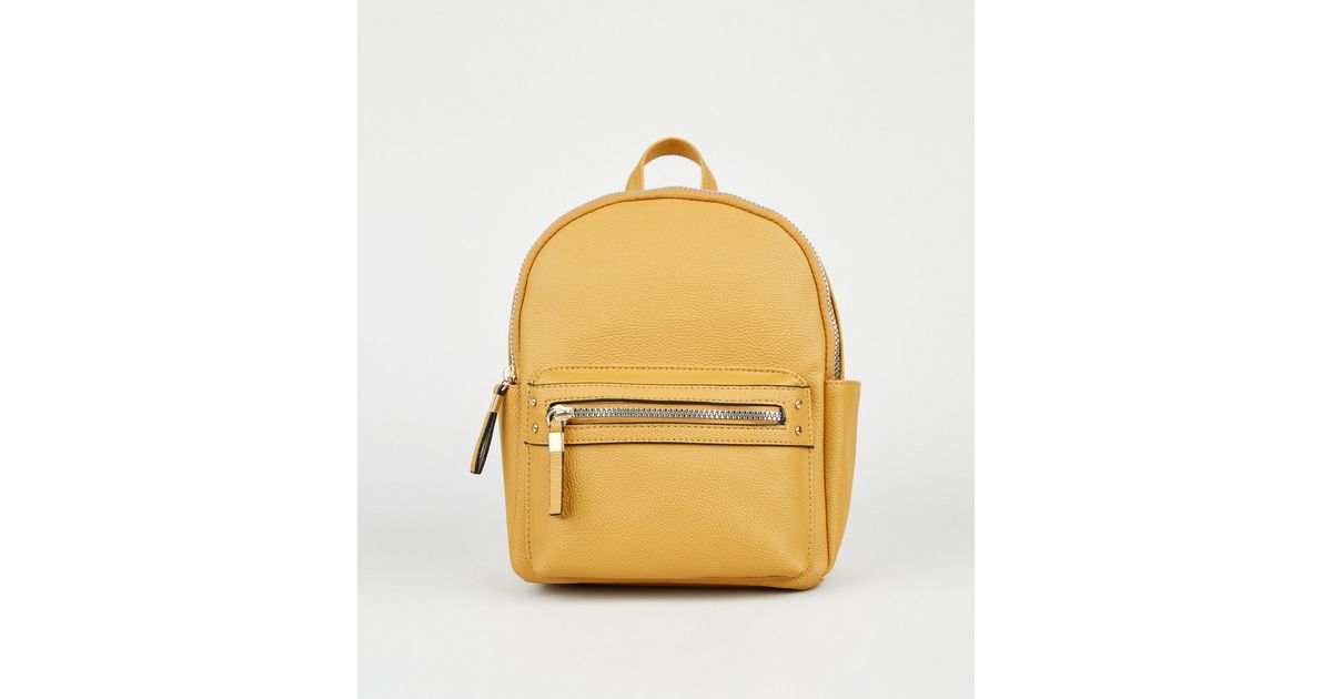 mustard mini backpack