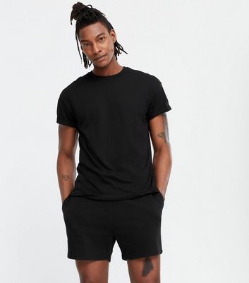 T shirt en coton noir manches courtes retrouss es New Look