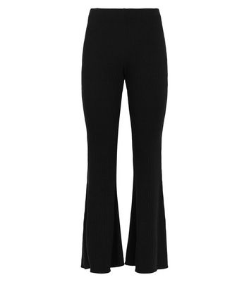 Click to view product details and reviews for Petite Black Ribbed Flared Leggings New Look.