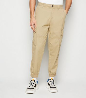 Buy HRX By Hrithik Roshan Men Cream Coloured Solid Regular Fit Cuffed  Joggers  Trousers for Men 1408831  Myntra