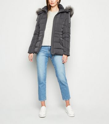 dark grey puffer coat with fur hood