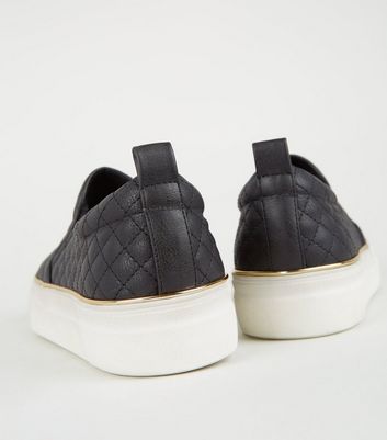 black quilted slip ons