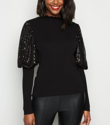 black jumper with sequin sleeves