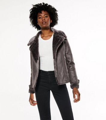 Grey leather shop jacket with fur