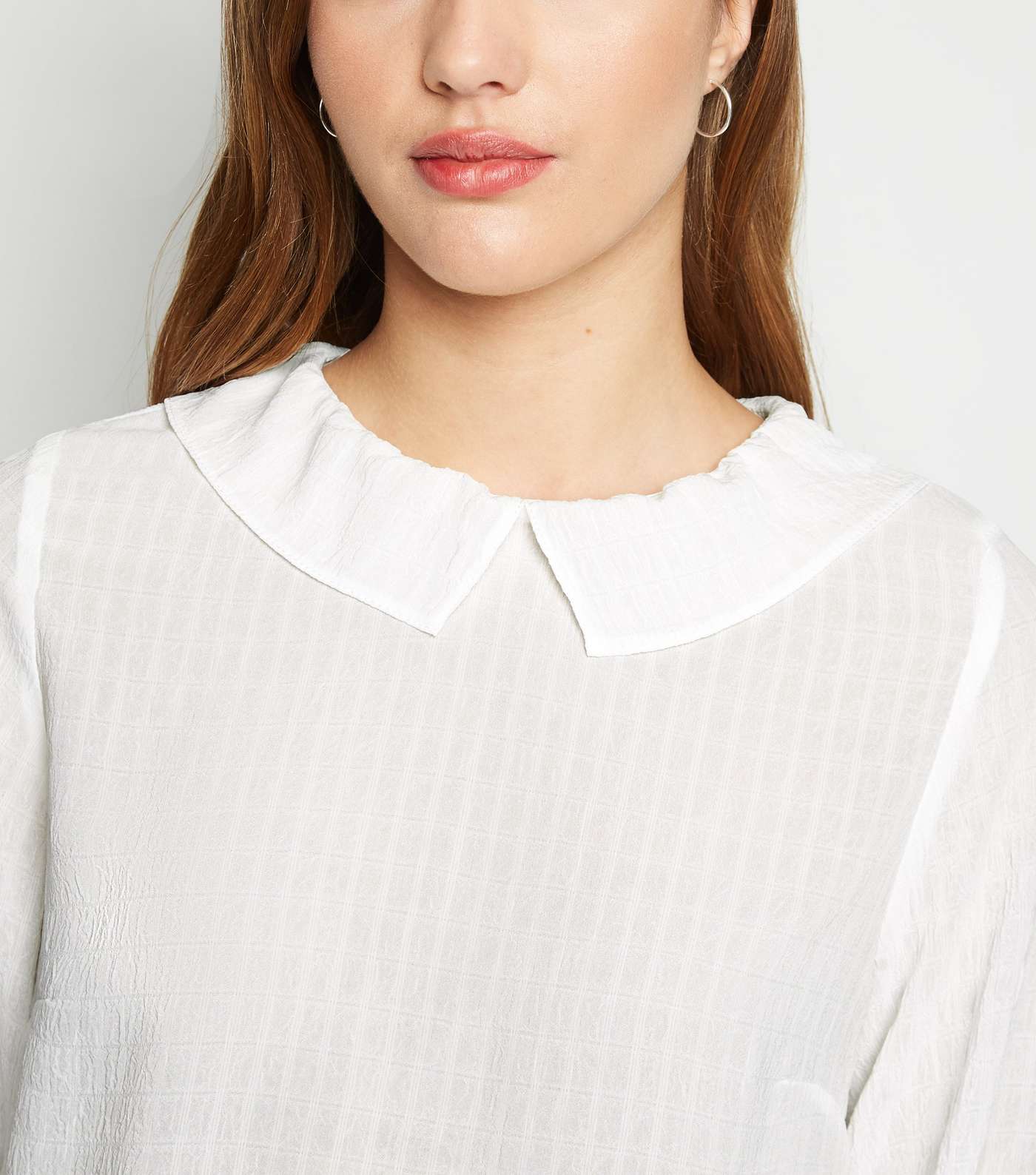 Off White Textured Collared Peplum Blouse Image 5