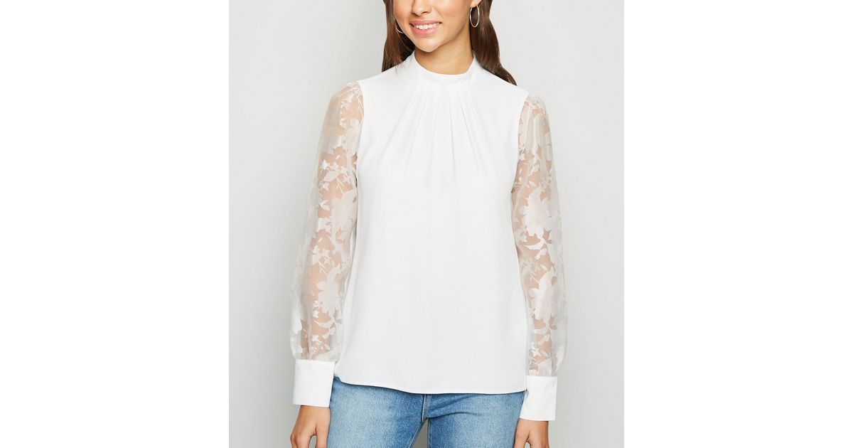 White High-Neck Blouse with Wing