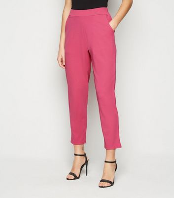 bright pink trouser suit