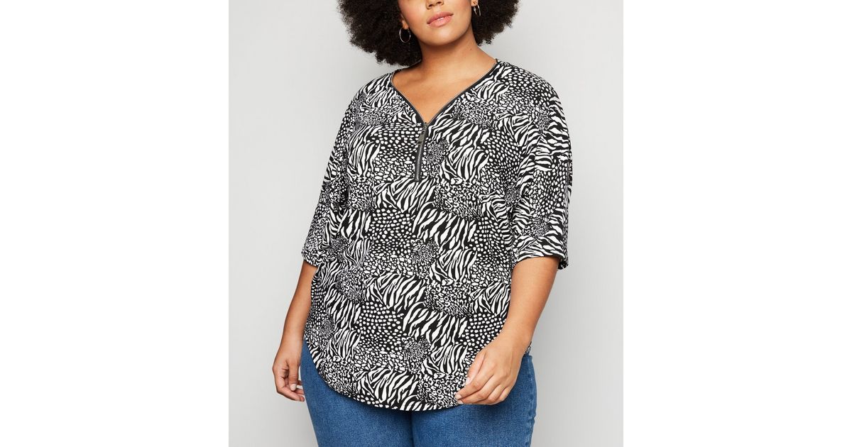 blue and black animal print top