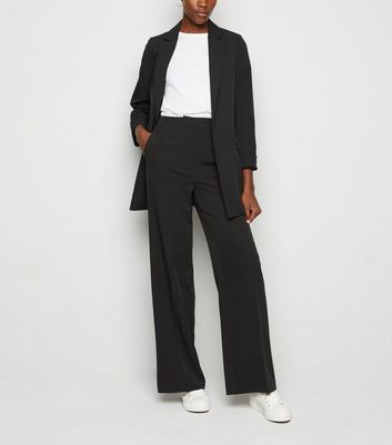 tall black high waisted trousers