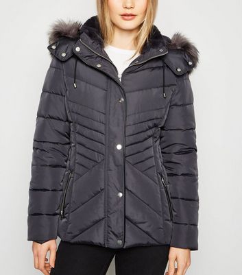 dark grey puffer coat with fur hood