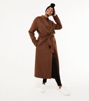 belted tan coat