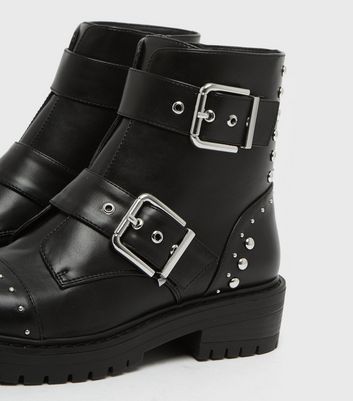 Black boots with shop studs and buckles