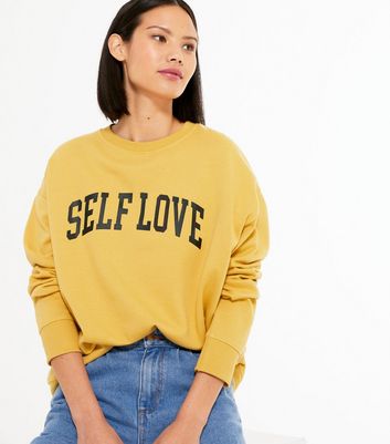 yellow slogan jumper