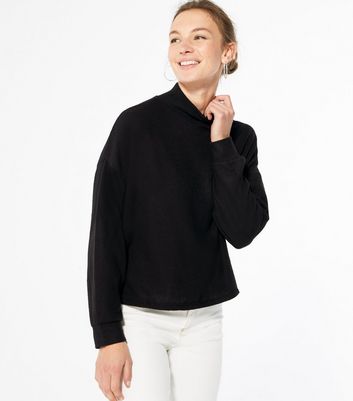 black jumper high neck