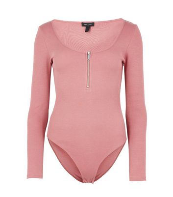 The Pink Zip-Up Bodysuit You Need In Your Closet