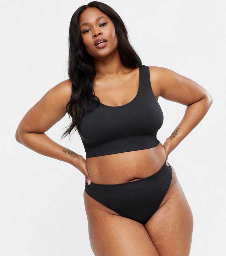 https://media2.newlookassets.com/i/newlook/669283701/womens/clothing/lingerie/curves-black-ribbed-seamless-crop-top-bra.jpg?strip=true&qlt=50&w=720