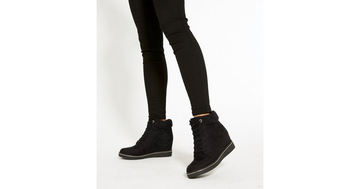 black faux fleece cuff wedge heel trainers