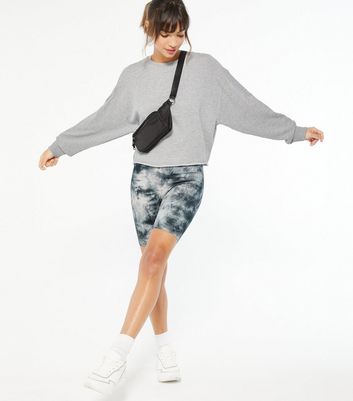 tie dye shirt and biker shorts