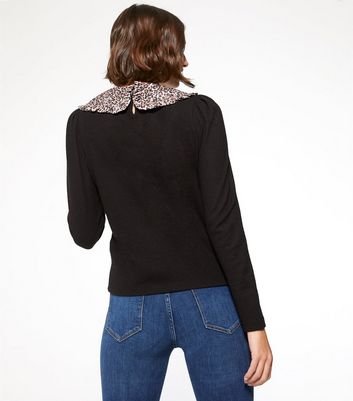 black jumper with leopard print collar