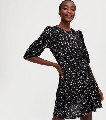 black polka dot dress with puff sleeves