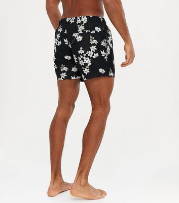 Black floral sales swim trunks