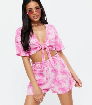 Click to view product details and reviews for Pink Tie Dye Knot Beach Crop Top New Look.