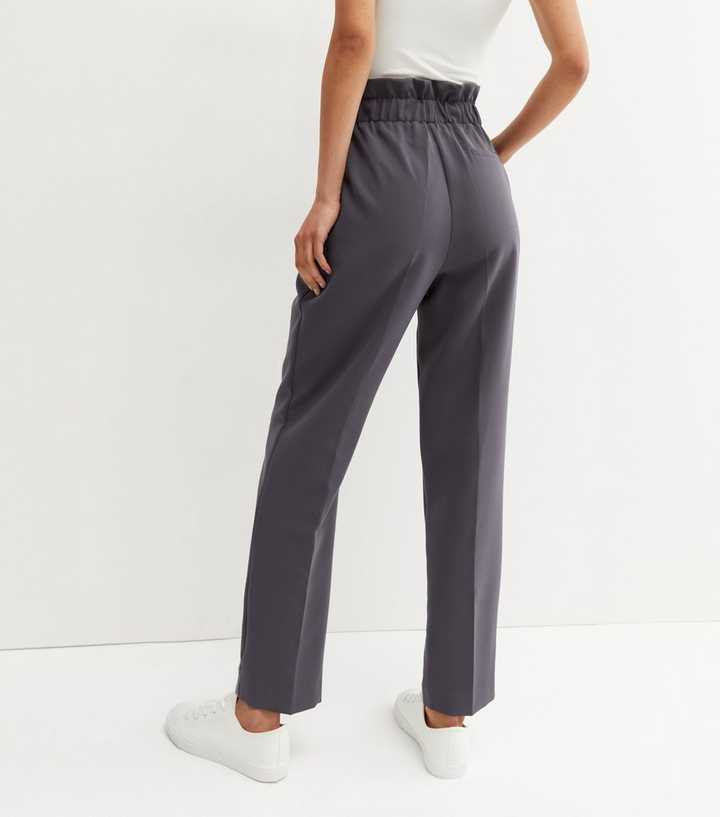 https://media2.newlookassets.com/i/newlook/681791703M3/womens/clothing/trousers/tall-dark-grey-elasticated-tie-waist-trousers.jpg?strip=true&qlt=50&w=720