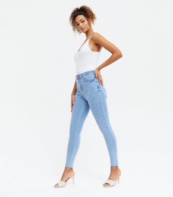 blue ripped hem skinny jeans