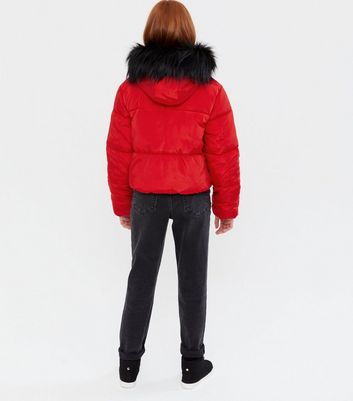 red puffer jacket with black fur hood