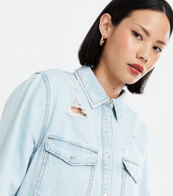 light wash denim jacket ripped