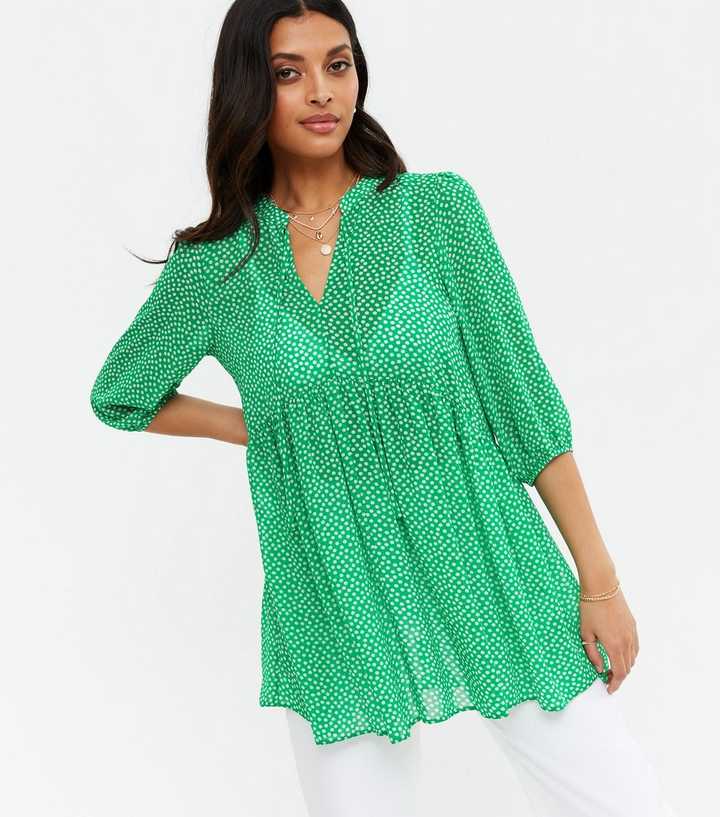 https://media2.newlookassets.com/i/newlook/688046039/womens/clothing/tops/green-spot-chiffon-tie-neck-long-tunic-blouse.jpg?strip=true&qlt=50&w=720