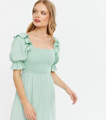 green shirred midi dress