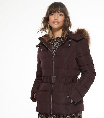 Click to view product details and reviews for Burgundy Faux Fur Hood Fitted Puffer Jacket New Look.