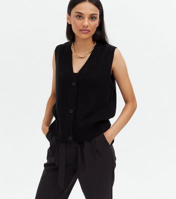 Click to view product details and reviews for Black Ribbed Knit Button Front Long Sleeveless Vest New Look.