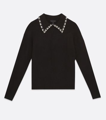 black sweater with pearl collar