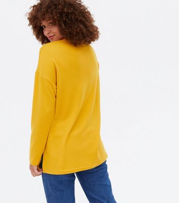 mens yellow sweater outfit