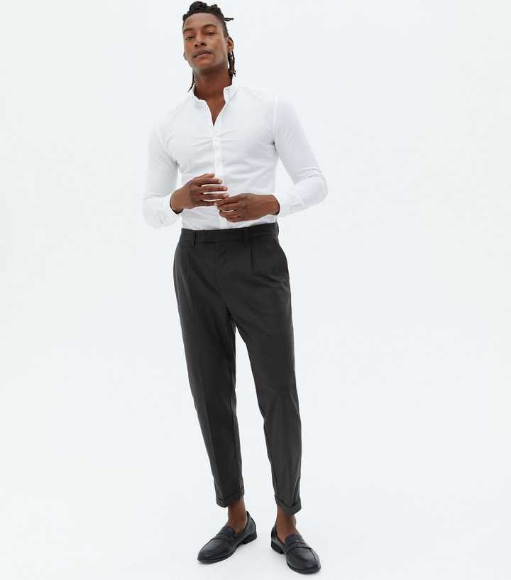 https://media2.newlookassets.com/i/newlook/696791803/mens/mens-clothing/mens-trousers/dark-grey-pleated-roll-hem-tapered-trousers.jpg?strip=true&qlt=50&w=720