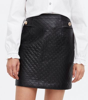 Click to view product details and reviews for Black Quilted Leather Look Button Mini Skirt New Look.