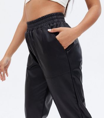Click to view product details and reviews for Petite Black Leather Look High Waist Joggers New Look.
