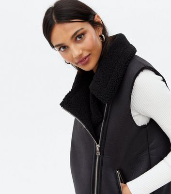 Click to view product details and reviews for Black Leather Look Sleeveless Aviator Jacket New Look.