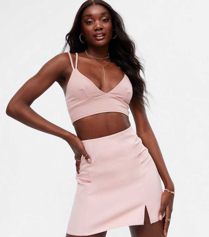 https://media2.newlookassets.com/i/newlook/801137272/womens/clothing/tops/pink-vanilla-pale-pink-strappy-cross-back-bralette.jpg?strip=true&qlt=50&w=720