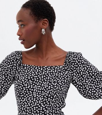 Click to view product details and reviews for Tall Black Ditsy Floral Square Neck Peplum Blouse New Look.