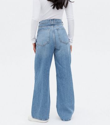 Click to view product details and reviews for Petite Blue High Waist Adalae Wide Leg Jeans New Look.