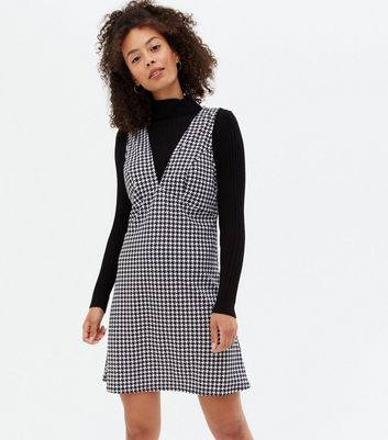 Click to view product details and reviews for Tall Black Dogtooth Scuba V Neck Pinafore Dress New Look.