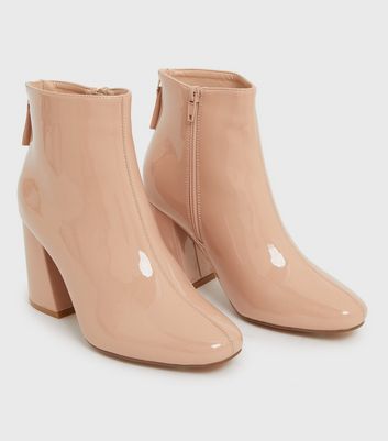 Nude patent store leather boots