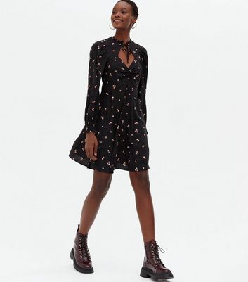 black dress with bow tie neck