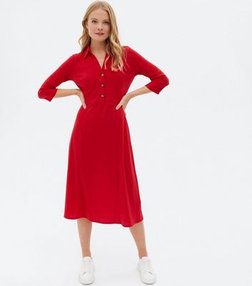 red dress with buttons down the front